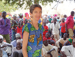 Dr. Ellen Einterz, who grew up in St. Matthew the Apostle Parish in Indianapolis, stops to have her photo taken during a community gathering in Cameroon, the African country where she provided love and medical care during the 24&nbsp;years she served the people there. (Submitted photo)
