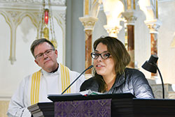 Father Michael O&rsquo;Mara, pastor of St. Gabriel the Archangel Parish in Indianapolis, listens as Zahrya Aremas of St. Patrick Parish in Indianapolis shares her witness as a Dreamer&mdash;an undocumented immigrant brought to the United States as a child&mdash;after a special Mass for &ldquo;Catholic Day of Action for Dreamers&rdquo; on Feb. 27 at St. John the Evangelist Church in Indianapolis. (Photo by Natalie Hoefer)