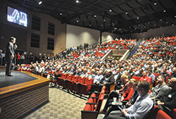 Dr. Ray Guarendi speaks on Feb. 24 before more than 1,200 men at the third annual E6 Catholic Men&rsquo;s Conference at East Central High School in St. Leon. The conference was organized by All Saints Parish in Dearborn County in the Batesville Deanery. (Photo by Sean Gallagher)