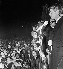 Robert F. Kennedy, right, gives a speech on April 4, 1968, in a park at 17th Street and Broadway Ave. in Indianapolis on the day of the assassination of Rev. Martin Luther King Jr. The speech has been credited with the fact that Indianapolis remained calm in the wake of King&rsquo;s death. (Indianapolis Recorder Collection, Indiana Historical Society)