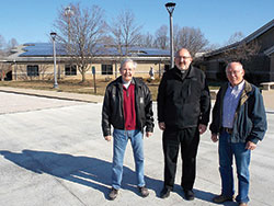 A statue of the Virgin Mary stands just below newly installed solar panels at St. John the Apostle Parish in Bloomington on March 15. Pope&nbsp;Francis has urged the world to use the Earth&rsquo;s resources responsibly. (Photo by Katie Rutter) 