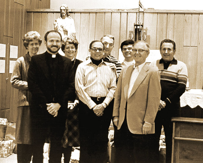 Gathered for this Jan. 6, 1983, photo are members of Most Sacred Heart of Jesus Parish in Jeffersonville. In the front row are Father Wilfred “Sonny” Day, left, Albert Jones, president of the parish council and Henry Striby. In the back row are Pauline Bourne, left, Judy Butcher, principal of the parish’s school, Paul Semones, Bob Hickey, director of religious education, and Charles Bernhart. Sacred Heart School was unique in the diocese for the presence of Dominican sisters. At the time of this photograph, three sisters taught in the school, two were retired, and three were residents in the parish. Sacred Heart Parish was founded in 1953.
