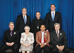 Catholic Charities Indianapolis presented four individuals with Spirit of Service Awards during an April 24 dinner in Indianapolis. Award recipients, seated from left, are Michael Isakson, Rita Kriech, Paul Hnin and Dr. Michael Patchner. Standing, from left, are David Bethuram, executive director of the archdiocese&rsquo;s Catholic Charities, Archbishop Charles C. Thompson and keynote speaker Joe Reitz. (Submitted photo by Rich Clark)