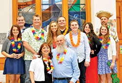 The 10 children of Jim and Ann Selby of St. Monica Parish in Indianapolis have been in Catholic schools across a span of 37 straight years&mdash;a span that will end on June 1 when their youngest child Jacob will graduate from Cardinal Ritter Jr./Sr. High School in Indianapolis. Nine of the 10 children are pictured here with their parents in a photo from 2014 when they threw a surprise party for their parents to celebrate their 60th birthdays. The children, from left to right, are Sarah, Patrick, Christopher, Maria, Andrew, Jacob, Anna, Caitlin and Matthew.&nbsp;The oldest child, Jon, was unable to attend. (Submitted photo)