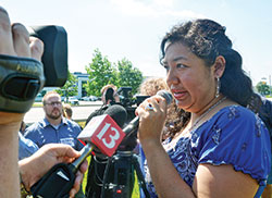 Erika Fierro speaks with members of the press after her May 31 meeting with Intensive Supervision Appearance Program officials in Indianapolis. She was expecting to be deported to Mexico during the meeting, but was instead given a removal date of June 26. That date, she says, is still too early for her two children&rsquo;s passports to be issued. (Photo by Natalie Hoefer)