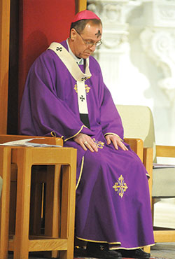 Archbishop Charles C. Thompson of Indianapolis prays during Ash Wednesday Mass on Feb. 14 at SS. Peter and Paul Cathedral in Indianapolis. The archbishop will gather in solidarity to pray for victims of sexual abuse and their families during a Holy Hour for Prayer, Penance and Healing at 11 a.m. on Sept. 15 at the cathedral. (File photo by Sean Gallagher)