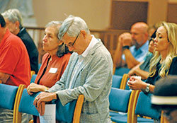 Katherine and Norbert Krapf kneel in silent prayer during the &ldquo;Holy Hour of Prayer, Penance and Healing&rdquo; in SS. Peter and Paul Cathedral in Indianapolis on Sept. 15. (Photo by Sean Gallagher)