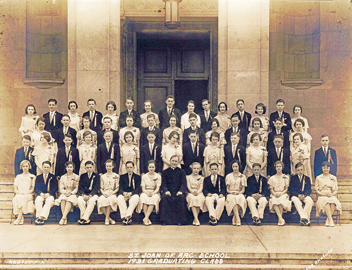 This photo depicts the eighth-grade graduating class of St. Joan of Arc School in Indianapolis in 1931. Shown in the center of the front row is Father Maurice O’Connor, who served as pastor of the parish from 1924-1939. St. Joan of Arc Parish was formed in 1921, and the school opened in January 1922. These graduates were the second class to complete all years of their elementary education at St. Joan of Arc School.