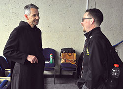Benedictine Brother John Mark Falkenhain, left, speaks on Oct. 25 with archdiocesan seminarian Liam Hosty in the auditorium of the Mother Theresa Hackelmeier Memorial Library at Marian&nbsp;University in Indianapolis. A licensed clinical psychologist who has researched clergy sexual&nbsp;abuse, Brother John Mark gave a presentation that day on the current clergy&nbsp;sexual abuse crisis in the Church. (Photo by Sean Gallagher)