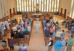 Archbishop Charles C. Thompson processes toward the altar in the chapel of the Little Sisters of the Poor&rsquo;s St. Augustine Home for the Aged in Indianapolis on Aug. 30, 2017, to celebrate Mass. The home is one of four senior care facilities in the archdiocese based on Catholic values. (File photo by Natalie Hoefer)