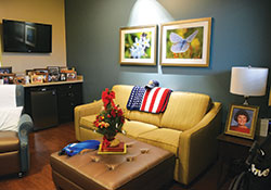 Comfortable rooms decorated with family photos and meaningful mementos&mdash;such as this room of a war veteran at Franciscan Hospice House in Indianapolis&mdash;are typical of hospice care homes. Hospice care, which falls under the umbrella of palliative care, seeks to help terminally ill patients live out their final days in comfort and peace. (Photo by Natalie Hoefer)