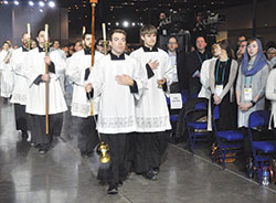 Archdiocesan seminarians James &ldquo;JJ&rdquo; Huber and Andrew Alig, front left and right, lead the procession for the opening Mass of SEEK2019 on Jan. 3 at the Indiana Convention Center in Indianapolis. (Photo by Sean Gallagher)