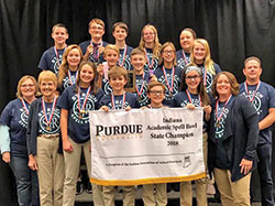 Students and coaches of the Spell Bowl team of St. Roch School in Indianapolis pose for a photo after winning the Indiana state championship in spelling at the Class 4 level, marking the sixth time in the past seven years that the school&rsquo;s team has won a state championship. (Submitted photo)
