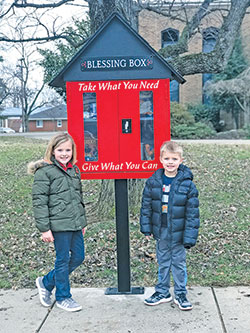 Parishioners of all ages at Most Sacred Heart of Jesus Parish in Jeffersonville are excited to help individuals and families in need through the &ldquo;Blessing Box&rdquo; on the parish grounds. Hadly, left, and Hays Nickell pose by the stand-alone structure that is filled with non-perishable food items and toiletries that anyone in need can access at any time of day. (Submitted photo)