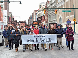 Students of Lumen Christi Catholic School in Indianapolis carry a banner as they process up Meridian Street in Indianapolis on Jan. 22, leading the second Indiana March&nbsp;for&nbsp;Life. (Photo by Natalie Hoefer)