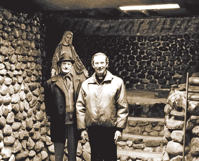 Originally intended to be a Marian shrine, the basement of the church at the former Holy Guardian Angels Parish in Cedar Grove appears in this photo from 1980. Standing in the shrine are Father James O&rsquo;Riley, pastor at that time, right, and parishioner Al Fohl. The basement was later converted into an adult education center. The parish was merged with St. Michael Parish in Brookville in 2013.