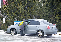 Sidewalk counselor Sheryl Dye speaks with a person pulling into the Planned Parenthood abortion center driveway in Indianapolis on Feb. 20&mdash;a Wednesday, one of the days abortions are performed at the facility. (Photo by Natalie Hoefer)