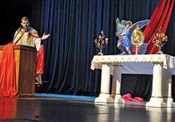 Father Jonathan Meyer, pastor of All Saints Parish in Dearborn County, gives a reflection during a time of eucharistic adoration during the fourth annual E6 Catholic Men&rsquo;s Conference on Feb. 23 at East&nbsp;Central High School in St. Leon. (Photo by Sean Gallagher)