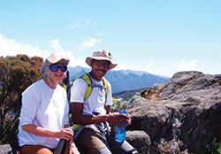 Dee Anne and Paul Sinclair, teachers at Father Thomas Scecina Memorial High School in Indianapolis, smile before their climb up Mount Kilimanjaro in Tanzania in eastern Africa during the summer of 2018. The Sinclairs were able to take part in their adventure thanks to two grants awarded through the Lilly Endowment&rsquo;s Teacher Creativity Fellowship program, a program that helps &ldquo;educators to pursue their dreams and passions.&rdquo; (Submitted photo)