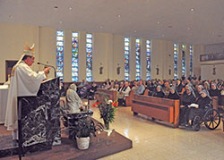 Archbishop Christophe Pierre, apostolic nuncio to the U.S., preaches during a March 19 Mass in the chapel of the St.&nbsp;Augustine Home for the Aged in Indianapolis. The liturgy marked the 150th anniversary of the start of ministry in the U.S. of the Little Sisters of the Poor, who operate the retirement facility. (Photo by Sean Gallagher)