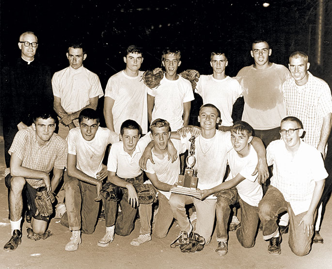 In 1963, the junior boys&rsquo; softball team from St. Anthony Parish in Indianapolis defeated the team from St. Philip Neri Parish, also in Indianapolis, by a score of 18-7 to win the CYO championship. The championship came at the end of an undefeated season for the team. In the back row on the far left is Father James Byrne, the priest moderator for the team. In the back row on the far right side is Joe&nbsp;Fox, the head coach. This photo was originally published in the Sept. 6, 1963, issue of The Criterion.