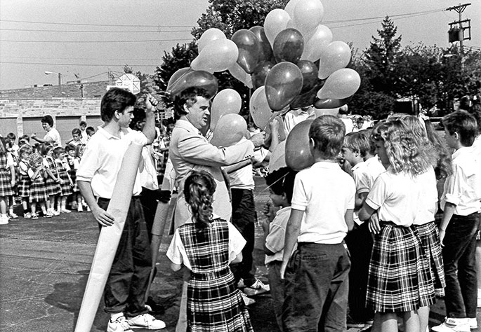 This photo from Sept. 8, 1989, shows Holy Spirit School in Indianapolis celebrating the 40th anniversary of its founding. School principal Kent Schwartz distributed balloons to five students from each grade level at the school, for a total of 40 balloons. The balloons were released following an all-school Mass.