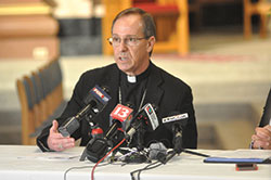 In an interview with The Criterion on July 1, Archbishop Charles C. Thompson discussed a range of issues in light of recent decisions by Cathedral&nbsp;High School and Brebeuf Jesuit Preparatory School, both in Indianapolis. Here, the archbishop speaks with Indianapolis media during a June 27 news gathering at SS. Peter and Paul Cathedral in Indianapolis. (Photo by Sean Gallagher)