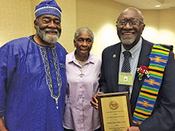 Holy Cross Brother Roy Smith, right, smiles after he received an award for his commitment to community service&mdash;an award that was presented to him on July&nbsp;24 in Baltimore during the annual joint conference of the National Black Catholic Clergy Caucus, the National Black Sisters&rsquo; Conference, the National Black Catholic Seminarians Association and the National Association of Black Catholic Deacons. He was joined during the awards ceremony by some of his siblings including Joseph Smith and Sister Demetria Smith, a Missionary Sister of Our Lady of Africa.&nbsp;(Submitted photo)