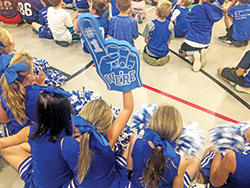 A cheerleader at Immaculate Heart of Mary School in Indianapolis holds up an oversized foam hand declaring &ldquo;We&rsquo;re #1&rdquo; during a school pep rally on Sept. 26 to celebrate the school&rsquo;s national recognition as a Blue Ribbon School of Excellence by the U.S. Department of Education. (Submitted photo)