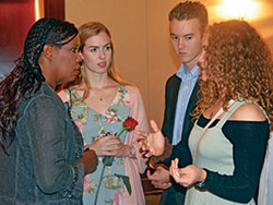 Pro-life advocate Star Parker speaks with Sally Jones, center, Daniel Hanes and Emma Lucchese after Right to Life of Indianapolis&rsquo; Celebrate Life Dinner in Indianapolis on Oct. 1. The three teens are seniors of North Central High School in Indianapolis. Sally, a member of Immaculate Heart of Mary Parish in Indianapolis, and Emma, a member of St. Luke the Evangelist Parish in Indianapolis, co-founded a pro-life club at the public school last year, along with their friend Margaret &ldquo;Maggie&rdquo; McPherson (not pictured), a member of St. Pius X Parish in Indianapolis. (Photo by Natalie Hoefer)