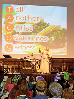 At a Deep Dive session on Nov. 22, Franciscan Friars of the Renewal Father Agustino Torres uses a TACOS acronym to remind NCYC youths to &ldquo;tell another Christ overcomes sadness.&rdquo; (Photo by Natalie Hoefer)
