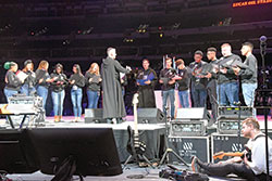 Benedictine Brother John Mark Falkenhain, a monk of Saint Meinrad Archabbey in St. Meinrad, leads youths in chanting the &ldquo;Salve Regina&rdquo; (&ldquo;Hail Holy Queen&rdquo;) on Nov. 22 in Lucas Oil Stadium in Indianapolis during the National Catholic Youth Conference. (Photo by Sean Gallagher)