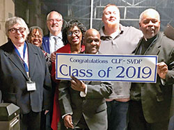 Society of St. Vincent de Paul members of St. Simon the Apostle Parish in Indianapolis and Divine Word Missionaries Father Charles Smith, Veterans Administration chaplain, celebrate with recent graduates of the first &ldquo;Changing Lives Forever&rdquo; program focused specifically on the needs of veterans on Nov. 25. Pictured are Phyllis Manfredi, left, program coordinator Domoni Rouse, Dave Kasberg, Brenda Ray, Paul Larkin, Landon &ldquo;Red&rdquo; Boyd and Father Smith. Not pictured is John Babcock. (Submitted photo)