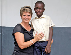 Chris Schwartz, a member of St. Bartholomew Parish in Columbus and middle school religion teacher at the parish&rsquo;s school, poses with Louvenyz Bouchette in 2016 during a mission trip to Limonade, Haiti. (Submitted photo) 