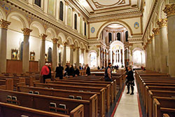 Visitors appreciate the restoration work done to St. Joan of Arc Church during an open house on Dec. 11, 2019. The $2.2 million phase of the project regarding the interior of the church sought to enhance its beauty. The parish&rsquo;s current church was completed in 1929. (Photo by Sean Gallagher)