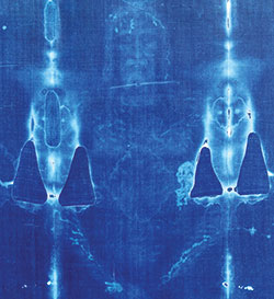 This color negative of the Shroud of Turin is taken from the original photograph shot by Barrie Schwortz in 1978 and includes places where the relic was damaged in a fire. Schwortz was the official documenting photographer for the Shroud of Turin Research Project in 1978&mdash;the first extensive scientific examination of one of the holiest relics of Christendom, which is housed in the Turin Cathedral in Italy. (&copy;1978 Barrie M. Schwortz Collection, STERA, Inc.)