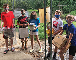 Youths volunteer for Holy Family Parish&rsquo;s St. Vincent de Paul conference in New Albany on Aug. 12. (Submitted photo)