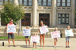 Denis, Ava, Raelyn, Buffy, Tessa and Carter O&rsquo;Brien, members of St. Jude Parish in Indianapolis, give witness as a family along North Meridian Street in Indianapolis during the national LifeChain event on Oct. 7, 2018. (Criterion file photo by Natalie Hoefer)