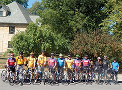 A group of cyclists taking part in the annual &ldquo;Biking for Babies&rdquo; poses on Sept. 19 in the parking lot of Our Lady of Lourdes Parish in Indianapolis. (Photo by Mike Krokos)