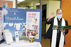 Archbishop Charles C. Thompson blesses Birthline Ministry&rsquo;s new space in the Xavier Building, 1435 N. Illinois St., on the campus of the Archbishop Edward T. O&rsquo;Meara Catholic Center in Indianapolis on Oct. 7. (Photo by John Shaughnessy)