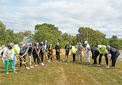 Archbishop Charles C. Thompson, center, joins others in breaking ground for the Indianapolis faith community&rsquo;s new church during a ceremony on Sept. 26. (Photo by Natalie Hoefer)