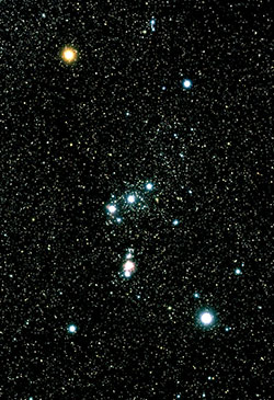 This ground-based image of the Constellation of Orion shows the &ldquo;belt&rdquo; and &ldquo;sword&rdquo; that together loosely form the capital letter &ldquo;T.&rdquo;  The fuzzy, red star near the middle of the sword is actually the Orion Nebula, and the bright light at its the bottom is Iota Orionis. (Photo credit: Akira Fujii)