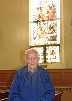 Lou Moster, a member of St. Michael Parish in Brookville, poses on Dec. 2, 2020, in the Batesville Deanery faith community&rsquo;s church. At 92 and a lifelong member of the parish, Moster has experienced more than half of its 175-year history. (Photo by Sean Gallagher)