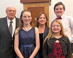 Evan and Jo Griffiths pose for a family photo with their three great-grandchildren, Mykiah, 16, Aidan, 14, and Lola, 13. Members of SS. Francis and Clare of Assisi Parish in Greenwood, the Griffiths were able to give their great-grandchildren a Catholic education at the parish school with the help of Indiana&rsquo;s Choice Scholarship Program, more commonly known as the voucher program. (Submitted photo)