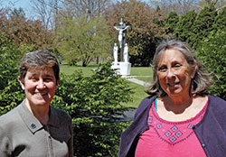 Benedictine Sister Sheila Marie Fitzpatrick, left, and Rosemary Spalding pose on the grounds of Our Lady of Grace Monastery in Beech Grove. They are among the members of the archdiocese&rsquo;s Creation Care Commission. (Photo by John Shaughnessy)