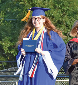 A member of the Class of 2020 at Bishop Chatard High School in Indiana&mdash;and its valedictorian that year&mdash;Margaret Corns shows off her diploma during the school&rsquo;s commencement ceremony on July 23, 2020. (Submitted photo)