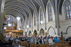 Catholics from central and southern Indiana wear masks in St. John the Evangelist Church in Indianapolis on Jan. 22 during the Mass solemnly recalling the U.S. Supreme Court&rsquo;s Jan. 22, 1973, Roe v. Wade decision legalizing abortion. Those worshipping at the Mass signed up in advance for tickets, since seating was limited to help stop the spread of the coronavirus. (File photo by Natalie Hoefer)