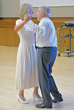 Stella and Elbert Wilson enjoy a dance at a reception in the Archbishop Edward T. O&rsquo;Meara Catholic Center in Indianapolis after the archdiocese&rsquo;s 37th annual Wedding Anniversary Mass on Aug. 29 across the street at SS. Peter and Paul Cathedral. Married for 65 years, the Wilsons are members of St. Mark the Evangelist Parish in Indianapolis. (Photo by Natalie Hoefer)