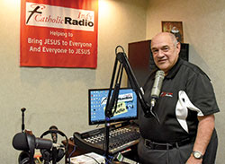 Jim Ganley, the retiring general manager and president of Catholic Radio Indy, stands on Sept. 21 in the station&rsquo;s studio in Indianapolis that has now been named after him. He has helped lead the station since it went on the air in 2004. (Photo by Sean Gallagher)