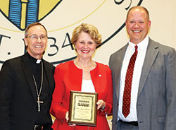 Former U.S. Rep. Susan Brooks poses with Archbishop Charles C. Thompson, left, and Marion County Superior Court Judge David Certo after receiving the Woman for All Seasons Award bestowed upon her by the Saint Thomas More Society of Central Indiana during a reception at the Archbishop Edward T. O&rsquo;Meara Catholic Center in Indianapolis on Oct. 5. (Submitted photo by Kim Pohovey)